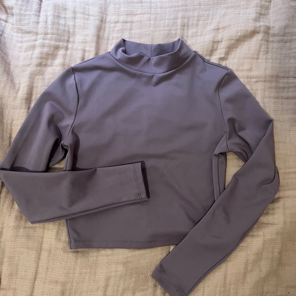 Cropped long sleeve, great for alone or layering